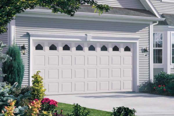 Classic wooden garage door with traditional paneling in a family home.